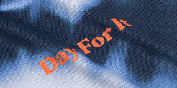Navy and white tie-dye running fabric with orange Day For It lettering from the Fractel better beer collab