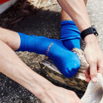 Unisex Blue Performance Running Socks on Model