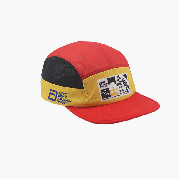 Red, yellow, and black AWMM M-Series cap on a white background