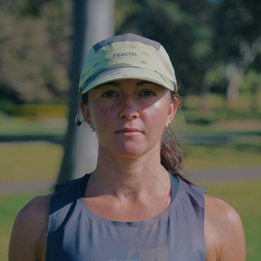 Person wearing the Fractel E-UNFURL Running Cap, front view