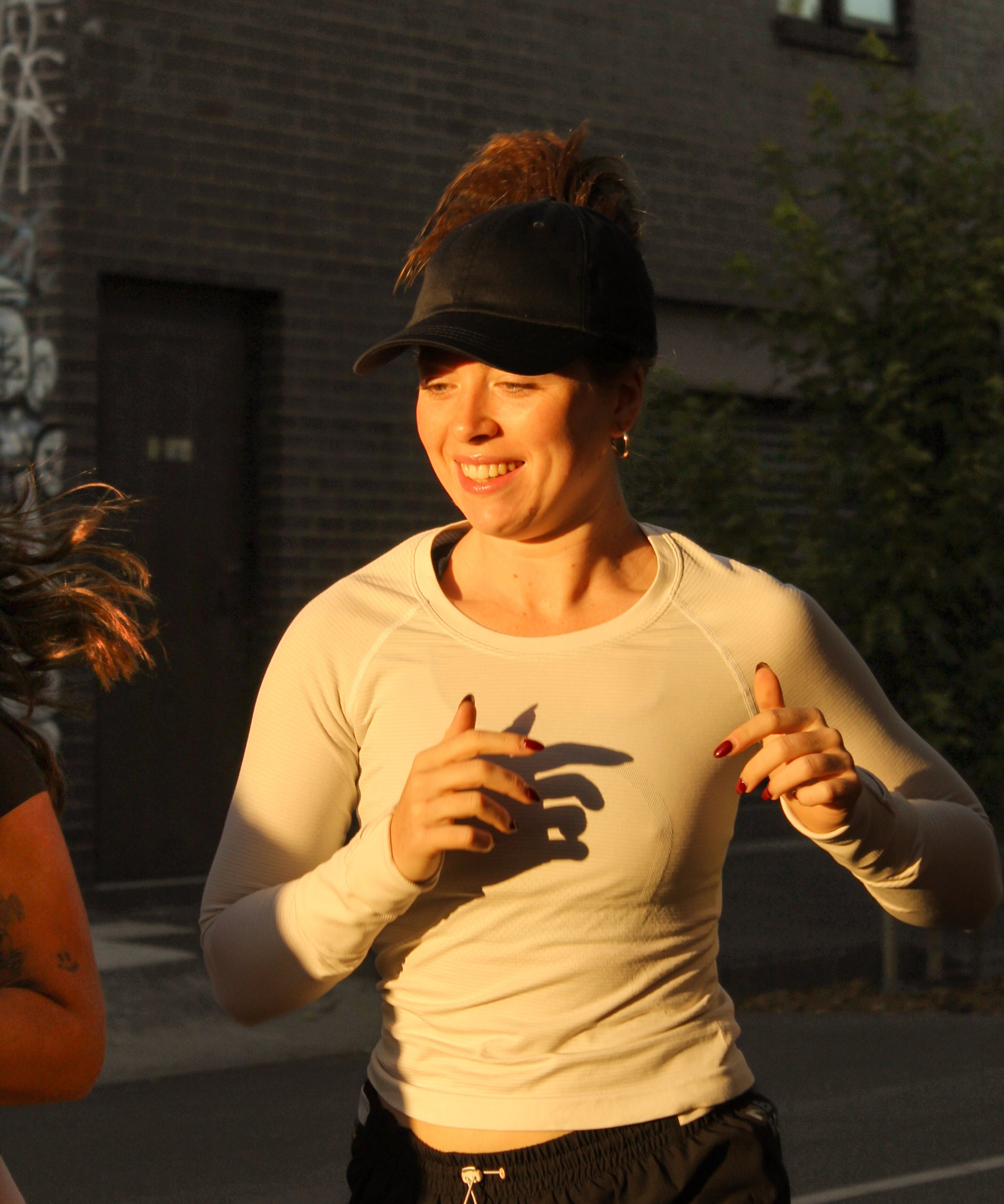 Runner wearing C-ASHEN High Ponytail Running Cap outdoors