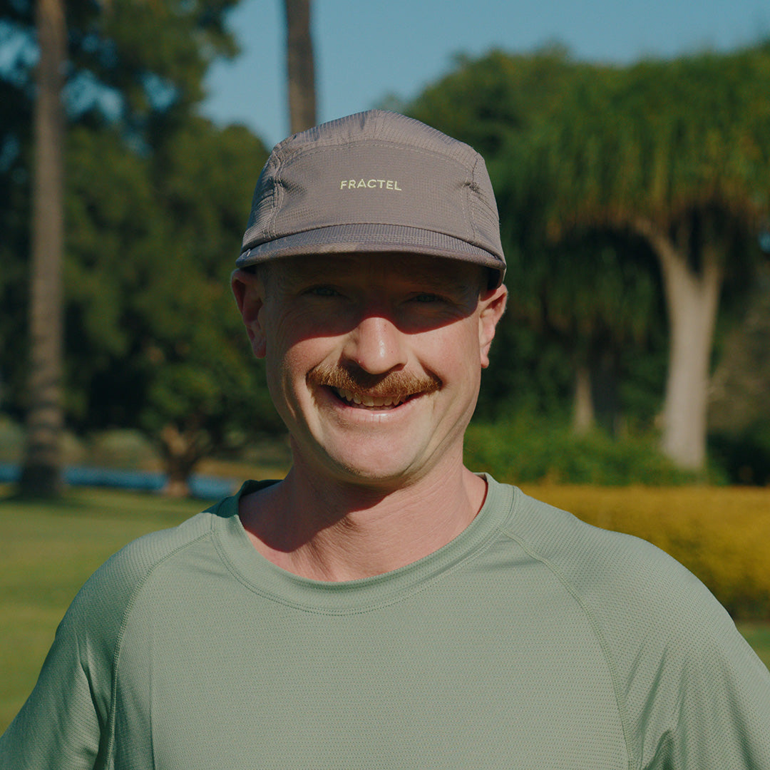Person wearing the Fractel M-OSSA Running Cap, front view