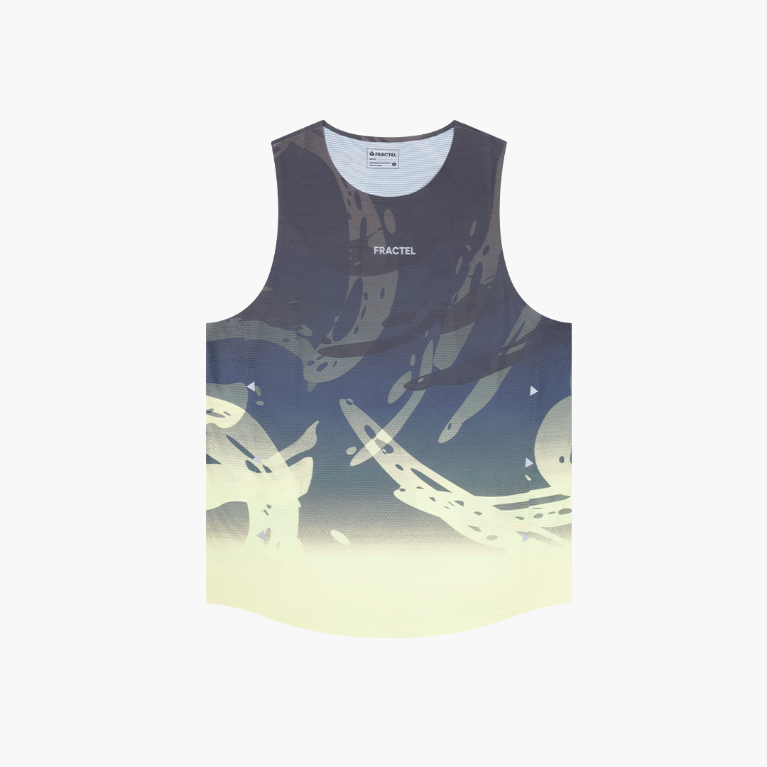 A sleeveless tank top with a dark abstract graphic print fading into a pale cream glow at the bottom, featuring the word 'FRACTEL' printed on the chest, shown on a light gray background.