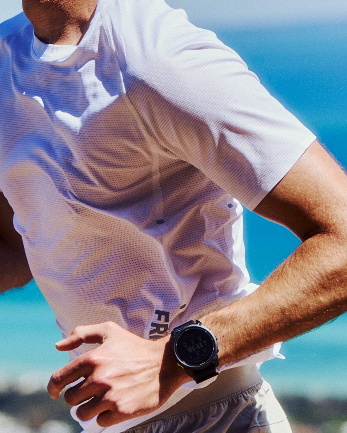 White Fractel tee worn on a coastal run, mens running tops