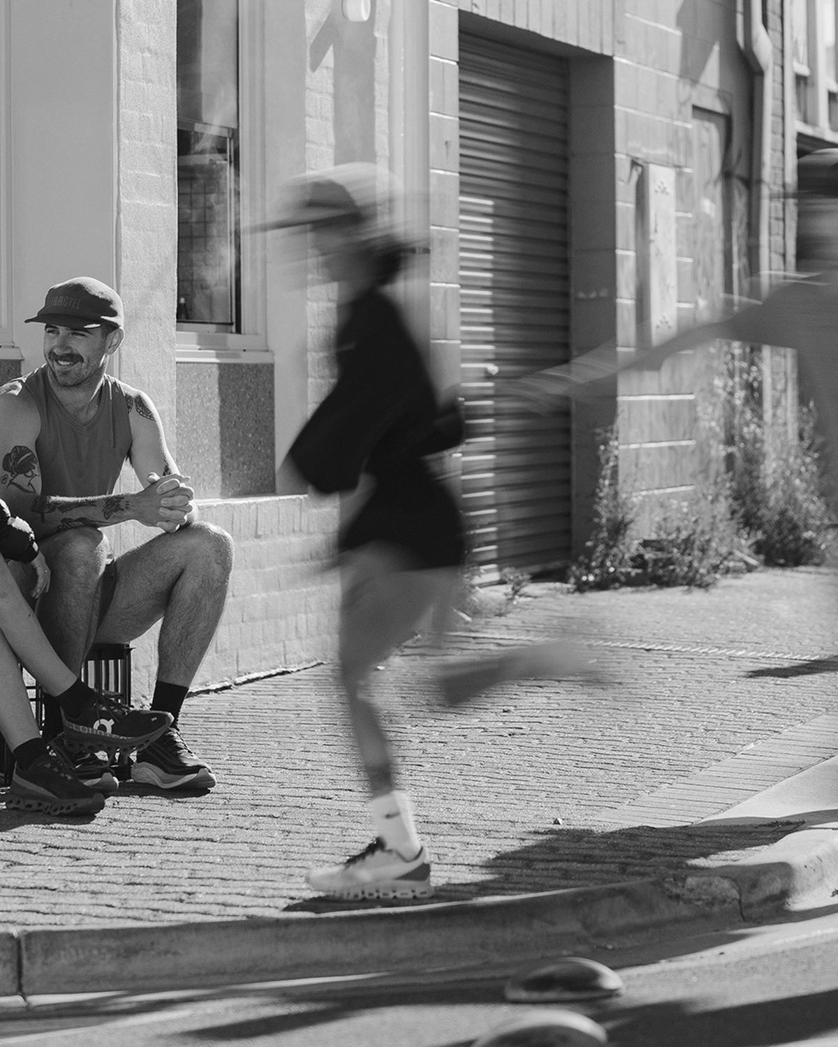 Shop all Fractel running gear online: blurred runners in black and white