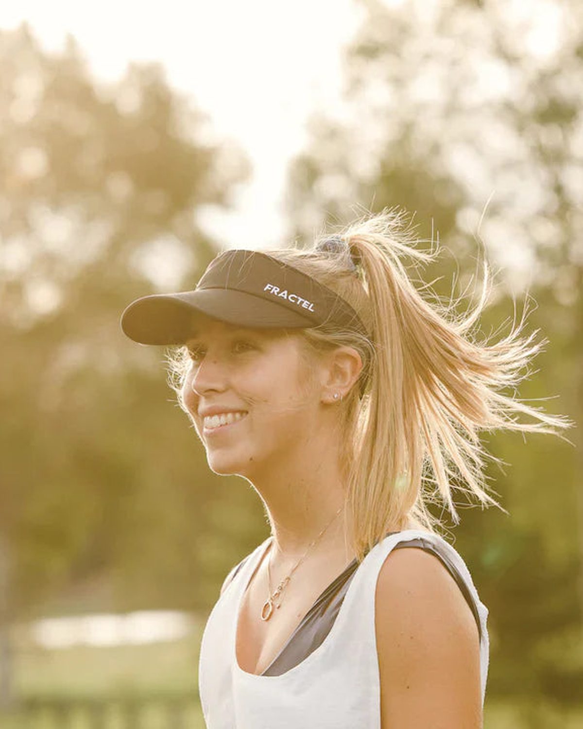 Black Fractel running visor worn on a golden hour run